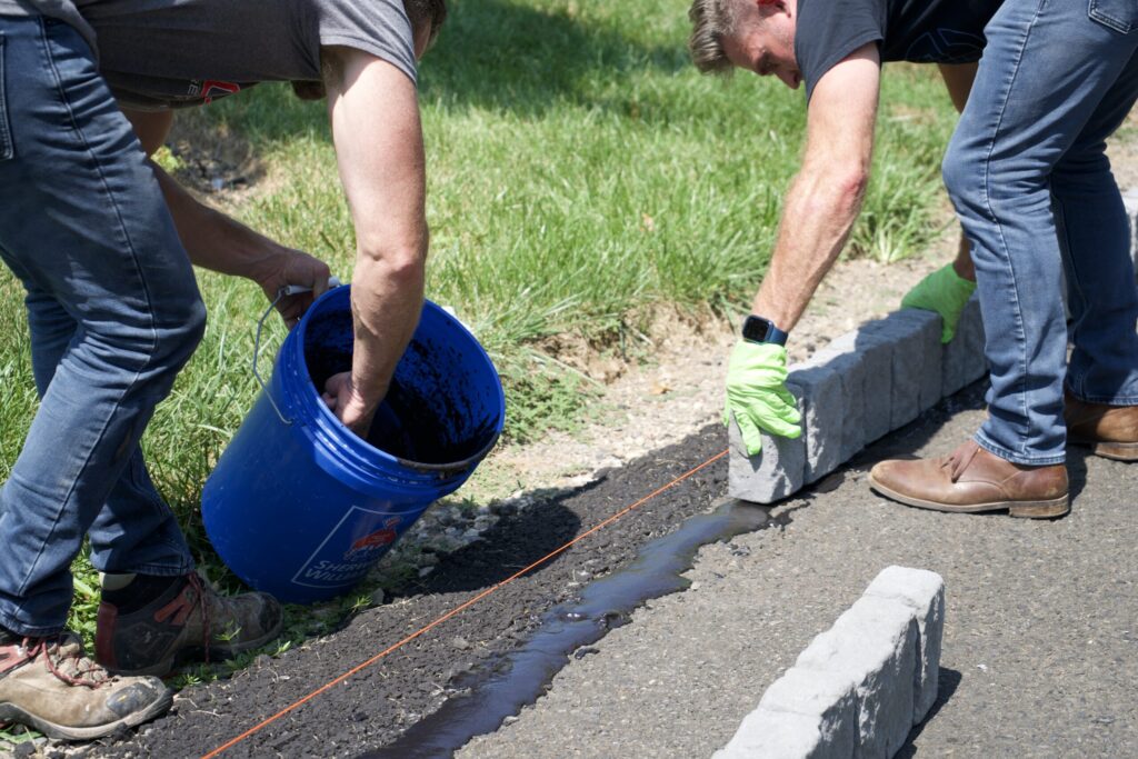 men applying quikurb